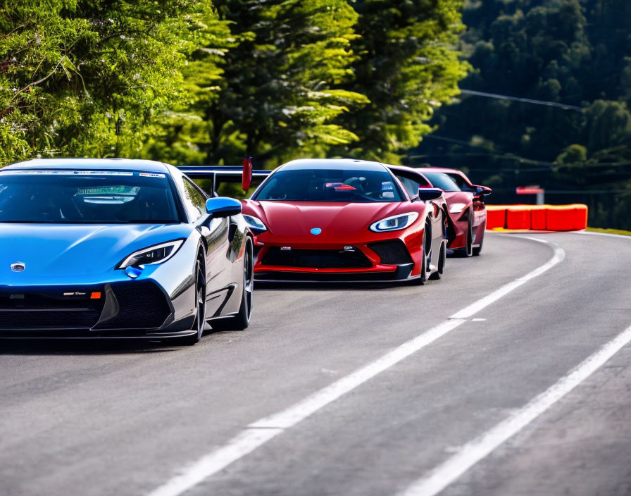 Colorful Sports Cars Drive on Sunlit Mountain Road