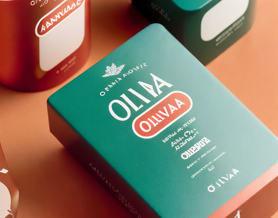 Teal-colored product box with sophisticated white and red label design