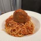 Spaghetti with Tomato Sauce and Meatballs in Volcanic Landscape