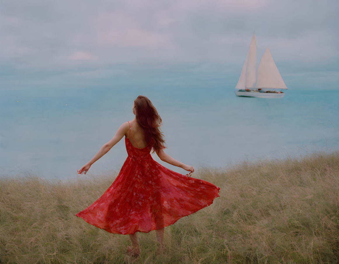 Woman in red dress gazes at sailboat in field by the sea