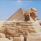 Ancient Pyramids and Sphinx in Desert Landscape