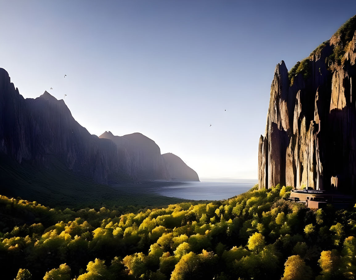 Tranquil valley with cliffs, sea, birds, trees, and clear sky