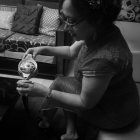 Traditional Asian Attire Woman with Porcelain Teapot and Ornate Teaware