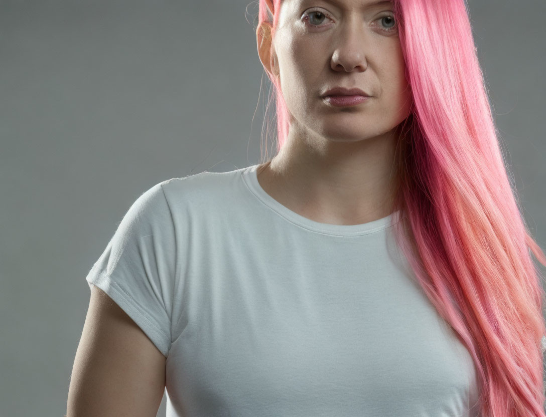 Pink-Haired Woman in White T-Shirt on Grey Background