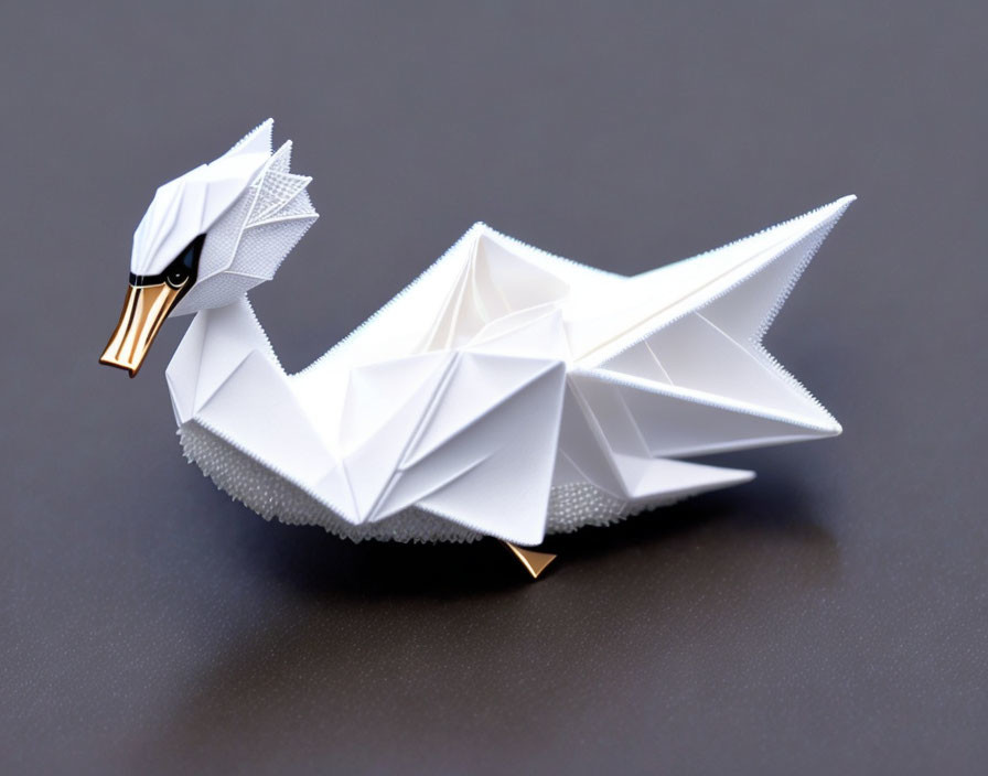 White Origami Swan with Gold Beak on Dark Surface