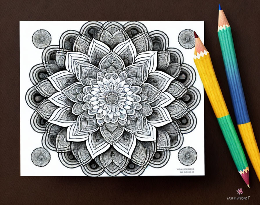 Detailed Black and White Mandala Drawing on Brown Surface