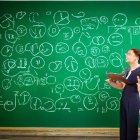 Businesswoman in glasses with mathematical chalkboard