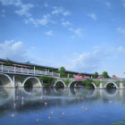 Traditional Asian bridge over calm river with pink water lilies and blue sky