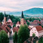 European Village in Snowy Setting with Colorful Buildings and Church Steeples