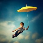 Person floating above clouds with umbrella under twilight sky