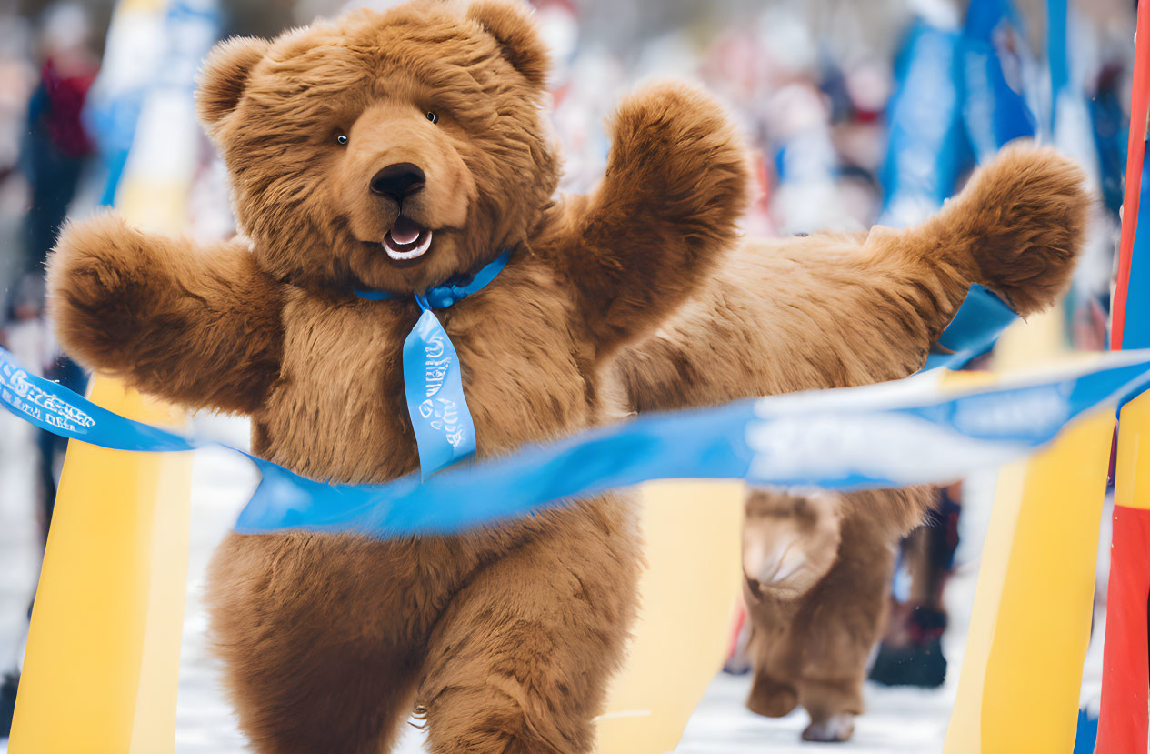 Bear mascot crossing finish line at race with raised arms surrounded by blue banners