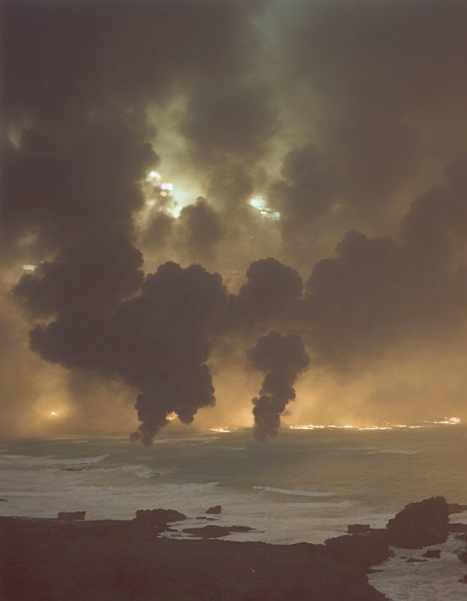 Dramatic volcanic eruption by ocean at dusk