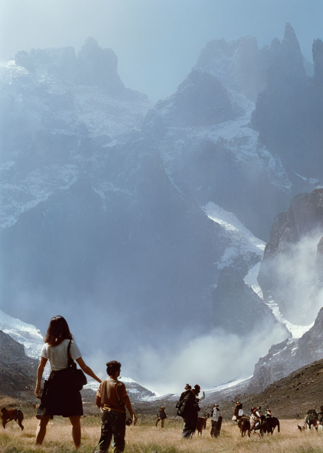 Two People Holding Hands Facing Mountains with Goats and Shepherds