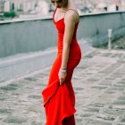 Surreal painting: person in red dress blending with brushstrokes