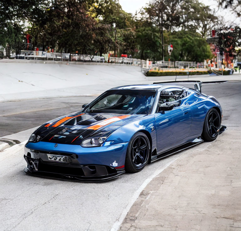 Blue Modified Sports Car with Racing Stripes and Rear Wing Parked in City Street