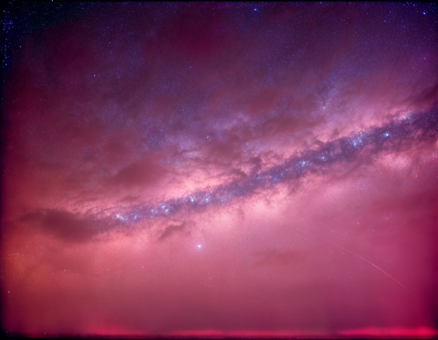 Stunning astronomical photograph of meteor, Milky Way, and stars in pink and purple sky