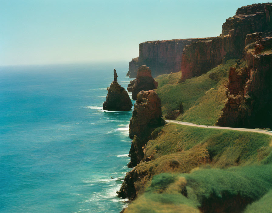 Scenic Coastal Landscape with Red Cliffs and Ocean View