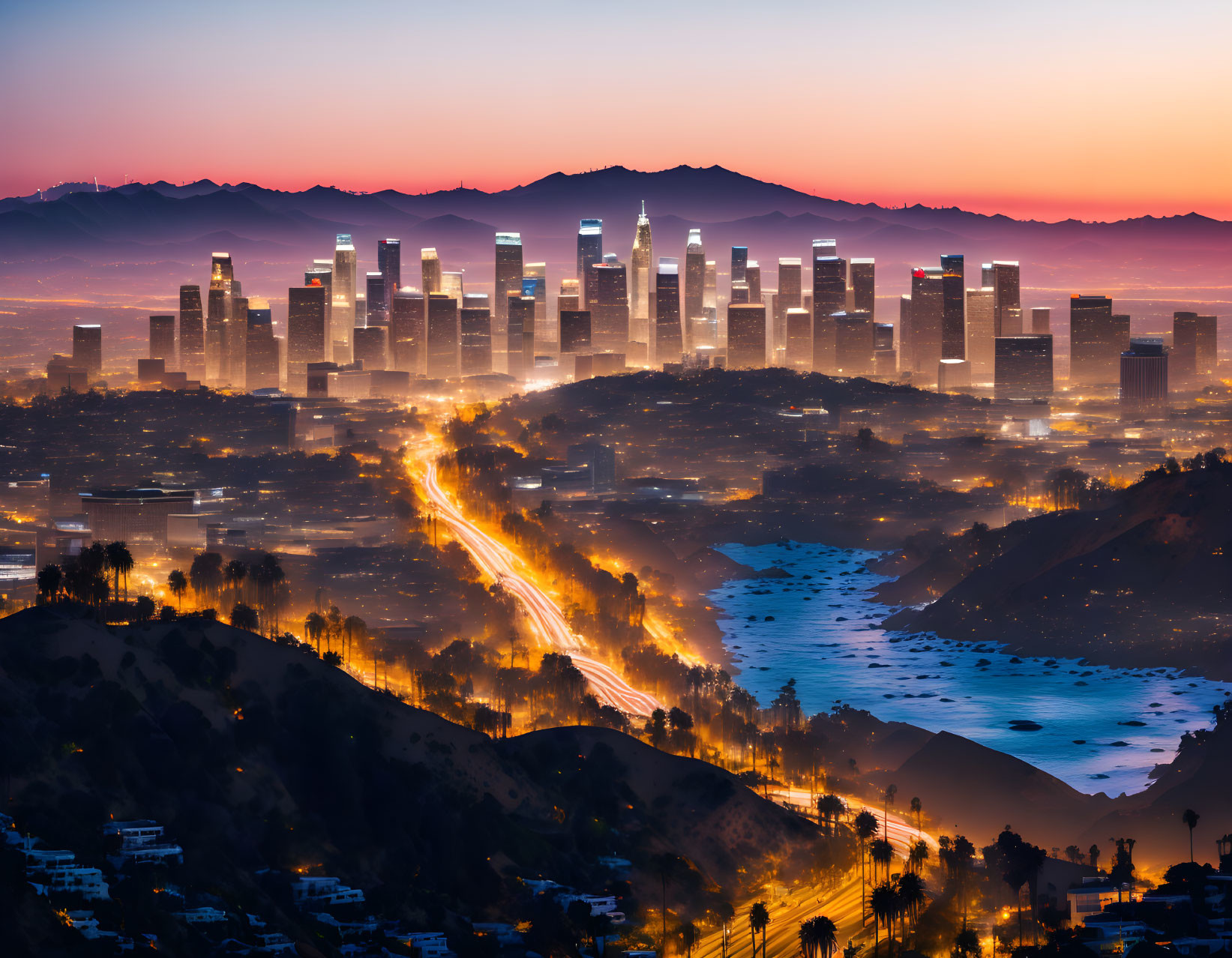 City skyline at twilight: Illuminated skyscrapers & light trails.