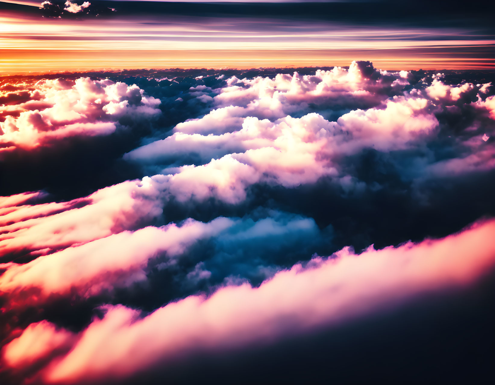 Colorful sunset sky with fluffy cumulus clouds