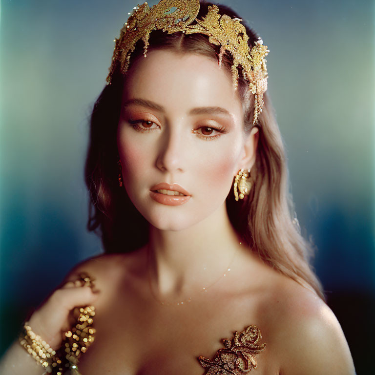 Elegant Woman in Golden Headpiece and Earrings