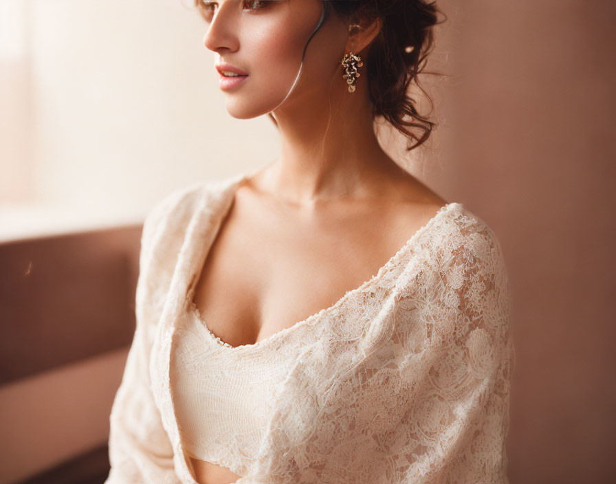 Elegant woman in lace attire gazing sideways