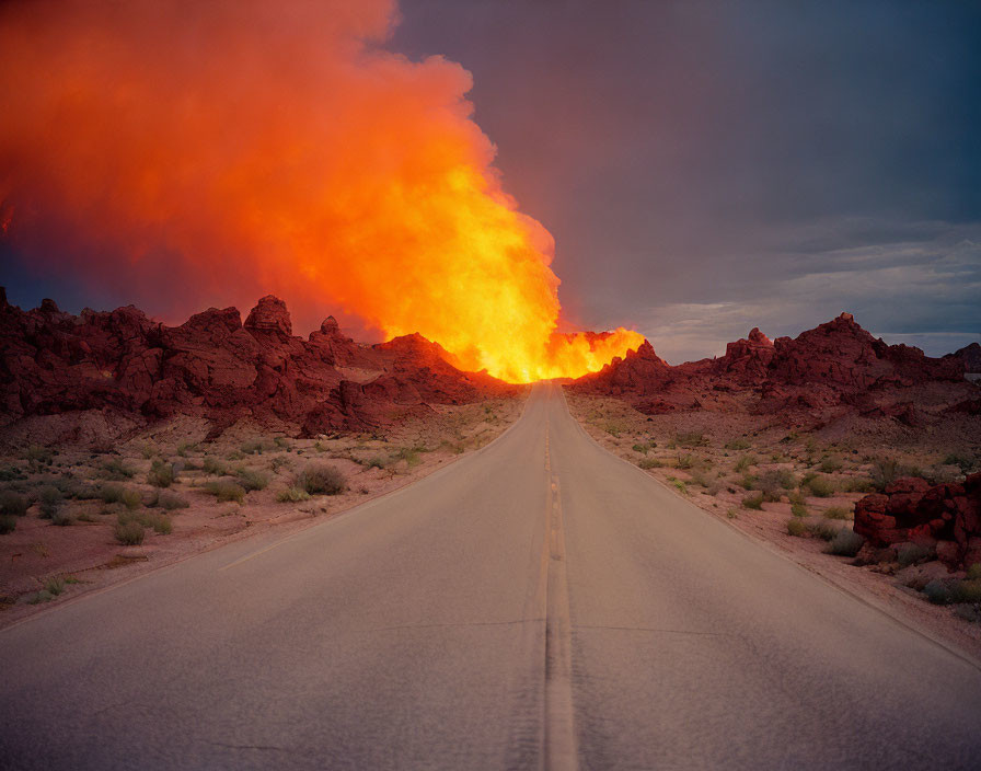 Fiery explosion at end of straight road in rocky terrain at dusk