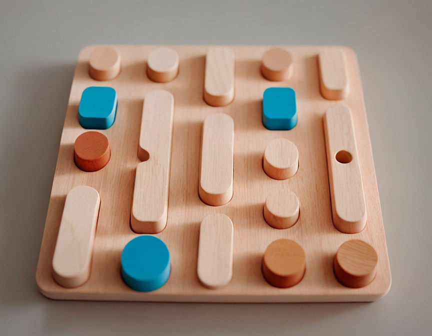 Wooden puzzle game with sliding pieces, cylindrical pegs, and blue squares on grooved board