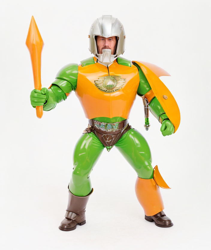 Superhero costume with green and orange colors, helmet, cape, and toy spear