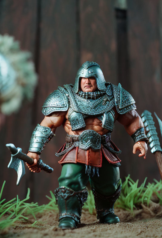 Fantasy warrior action figure in ornate armor with small axe on realistic backdrop