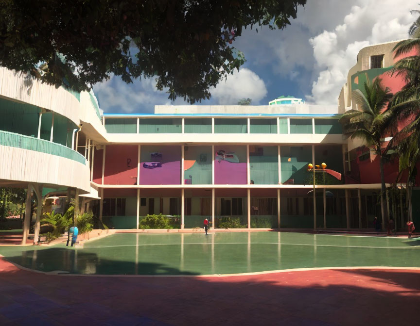 Curved facade modern building with large windows and green outdoor court