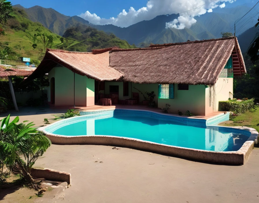 Scenic pool and colorful thatched roof house in lush valley