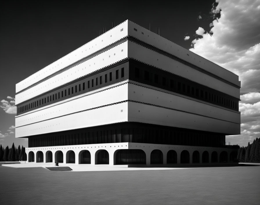 Monochrome photograph of modern tiered building with rows of windows