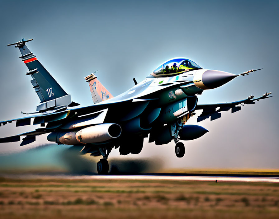 Military fighter jet with landing gear down in mid-flight displaying detailed livery and weaponry.