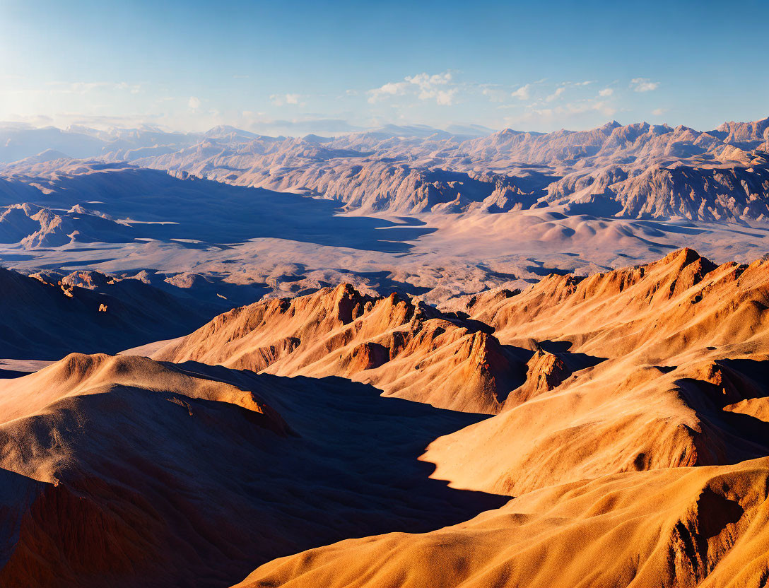 Arid Desert Landscape with Rugged Mountains and Sand Dunes