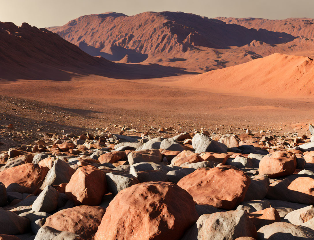 Rocky Desert Landscape with Sand Dunes and Red Mountains Under Blue Sky