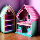 Colorful Toy Dollhouses with Detailed Furniture Against Purple Wall