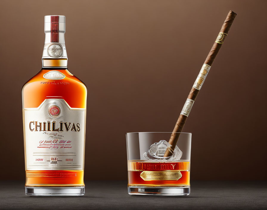 Chivas Regal whiskey bottle, cigar, and glass on brown backdrop