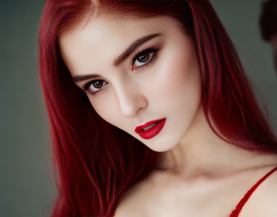 Vibrant red hair woman with bold makeup portrait