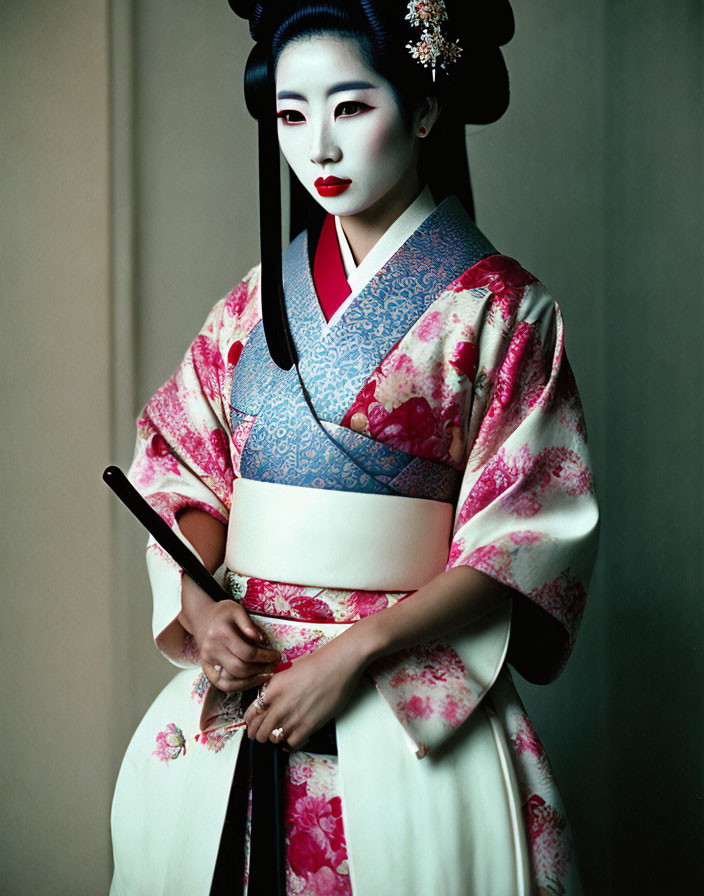 Traditional Japanese woman in kimono with obi, Shimada hairstyle, Geisha makeup, holding sham