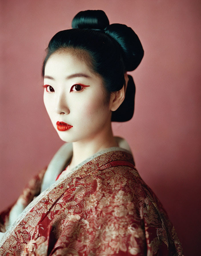 Traditional Japanese Makeup and Kimono with Prominent Hairstyle and Red & White Face Accents