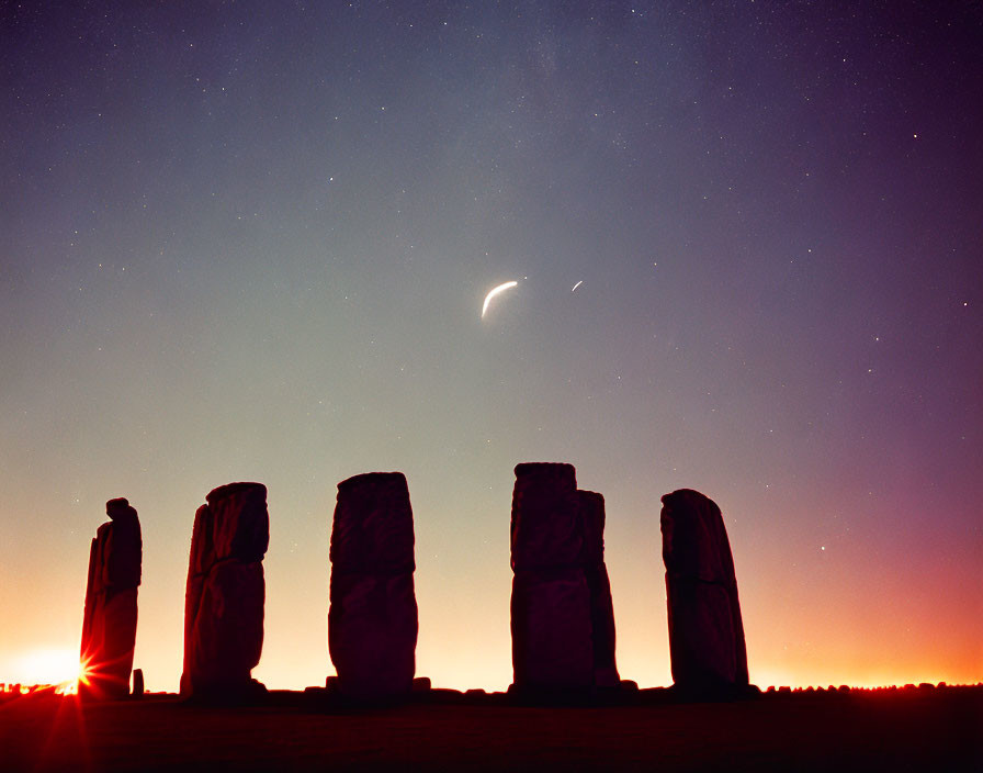 Ancient stone circle at twilight with stars, crescent moon, and sunrise