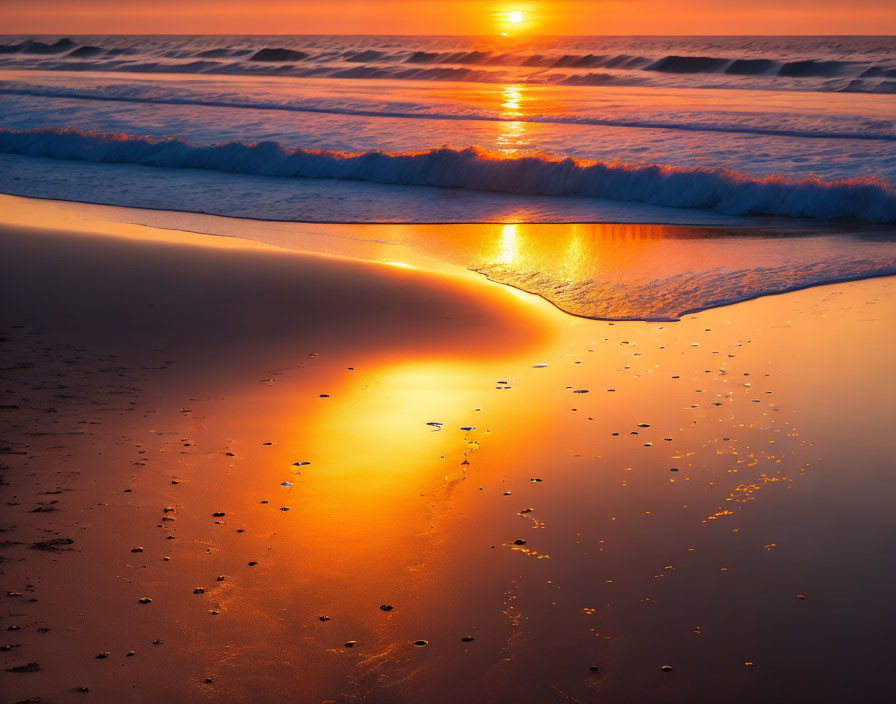 Tranquil beach sunset with gentle waves and warm sun reflection