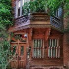 Ornate Fantasy Building with Blue and Gold Designs amid Ivy-Covered Surroundings