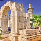 Fantastical palace with arches and spires in manicured gardens