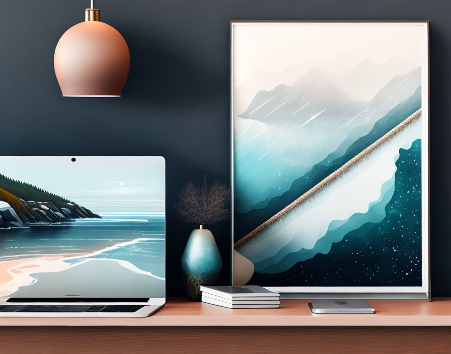 Contemporary workspace with laptop, abstract mountain art print, vase, books, and hanging lamp