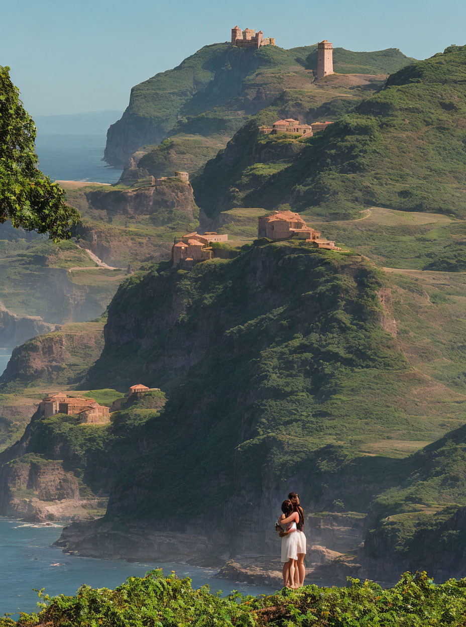 Couple embracing with ancient ruins and ocean view.