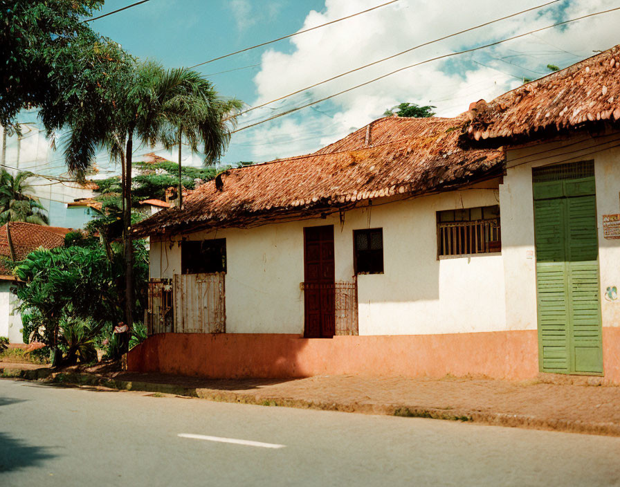 Traditional Single-Story House with Tiled Roof and Pastel-Colored Walls