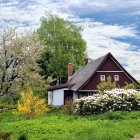 Tranquil countryside cottage in vibrant garden setting