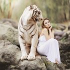 Girl in Pink Dress Sitting Next to Large Tiger in Colorful Forest Clearing