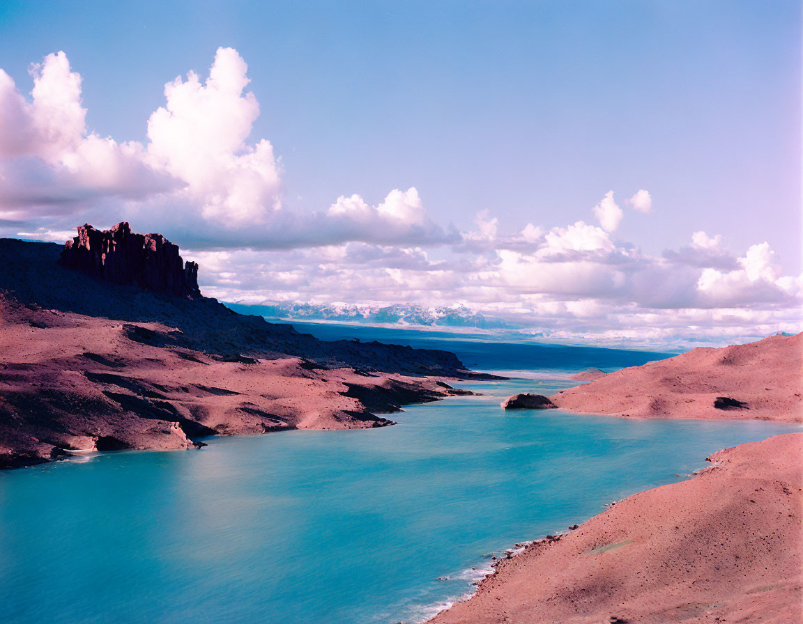 Tranquil Landscape: Turquoise Lake, Sandy Shores, Fluffy Clouds